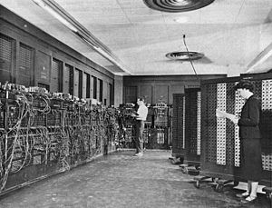 Glen Beck (background) and Betty Snyder (foreground) program the ENIAC in BRL building 328. (U.S. Army photo)