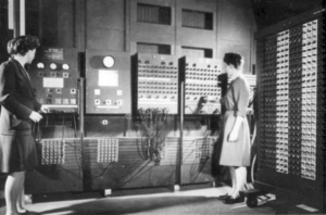 Programmers Betty Jean Jennings (left) and Fran Bilas (right) operate the ENIAC's main control panel at the Moore School of Electrical Engineering. (U.S. Army photo from the archives of the ARL Technical Library)